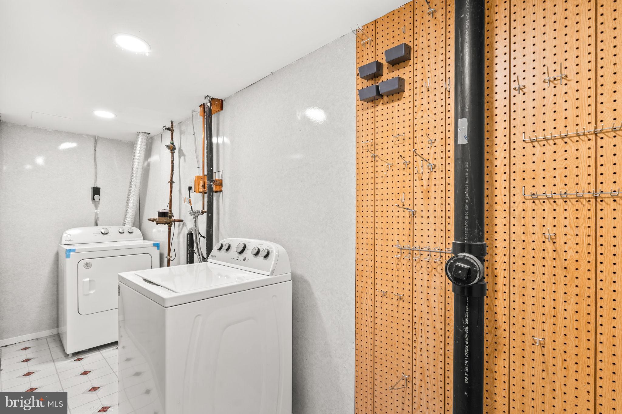 8433 Sugar Creek Lane Springfield, VA 22153 - Photo 36 of 47 Functional laundry space with organized storage.
