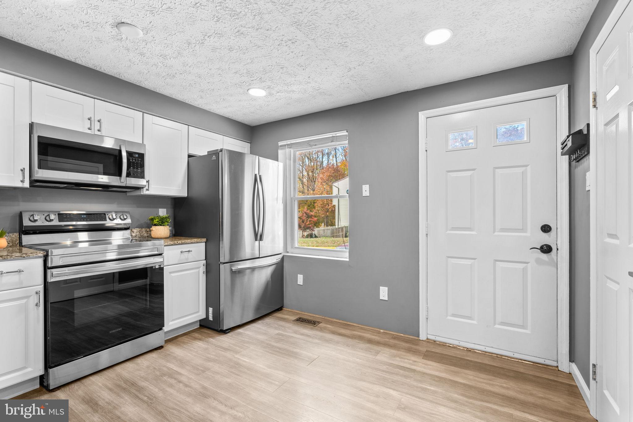 8433 Sugar Creek Lane Springfield, VA 22153 - Photo 10 of 47 Modern kitchen with sleek finishes.