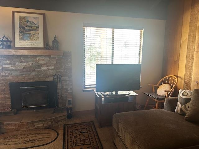 25 Lee Road, Unit 106 Mammoth Lakes, CA 93546 - Photo 7 of 16 Carpeted living area featuring a stone fireplace