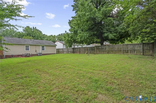 a house view with swimming pool in front of it