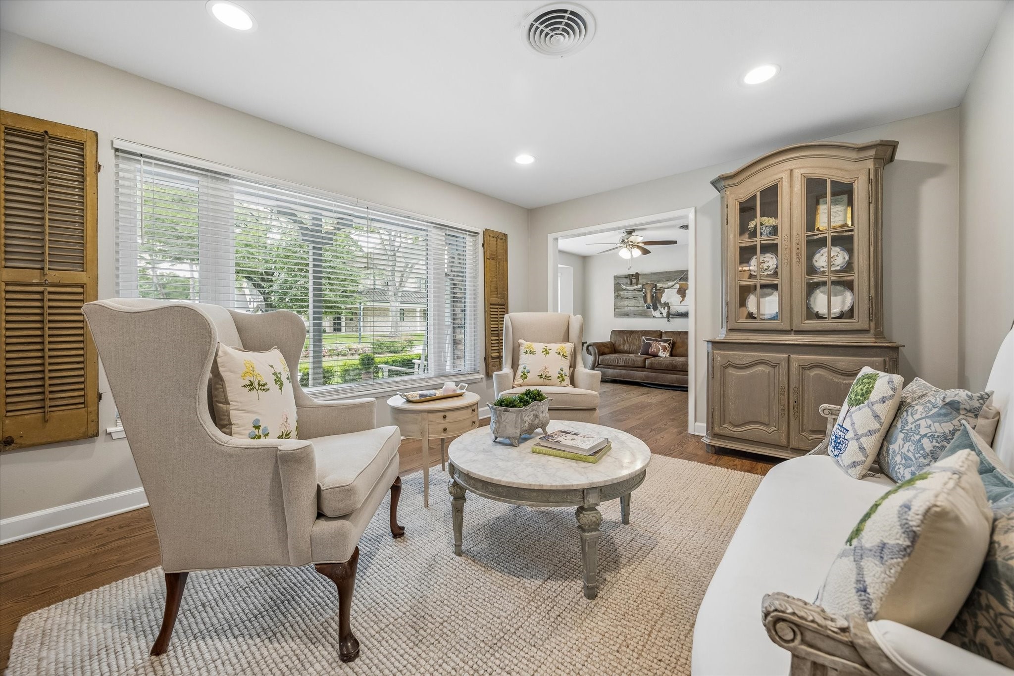 1018 Ben Hur Drive Spring Valley Village, TX 77055 - Photo 5 of 30 The living room is filled with natural light from large windows overlooking the landscaped front yard.