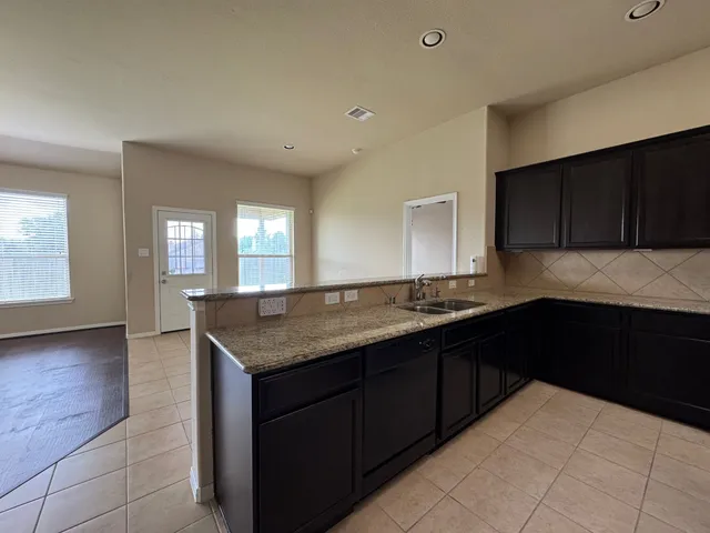 a kitchen with a cabinets counter space and a sink