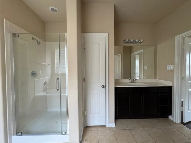 a bathroom with a bathtub and a sink