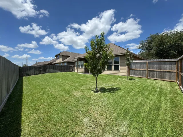a house view with garden space