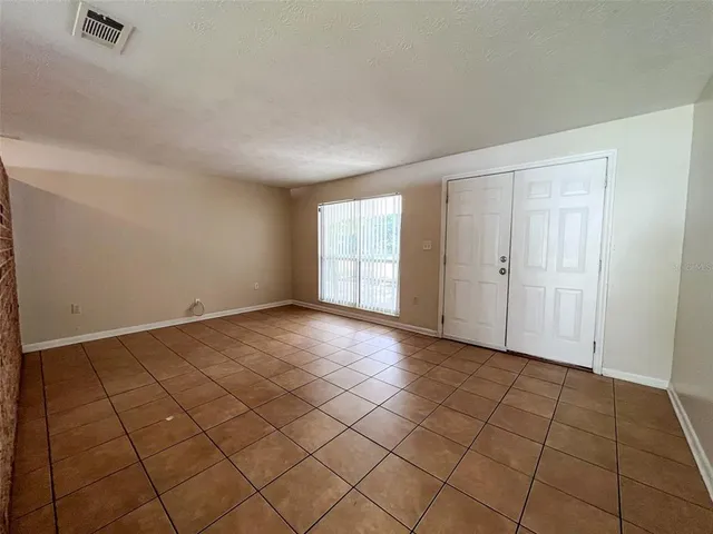 a view of an empty room and window
