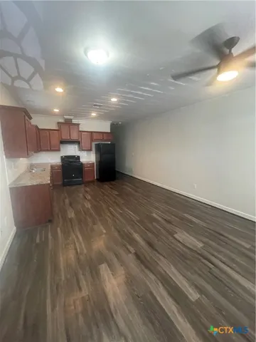 a view of a kitchen with a sink and a microwave