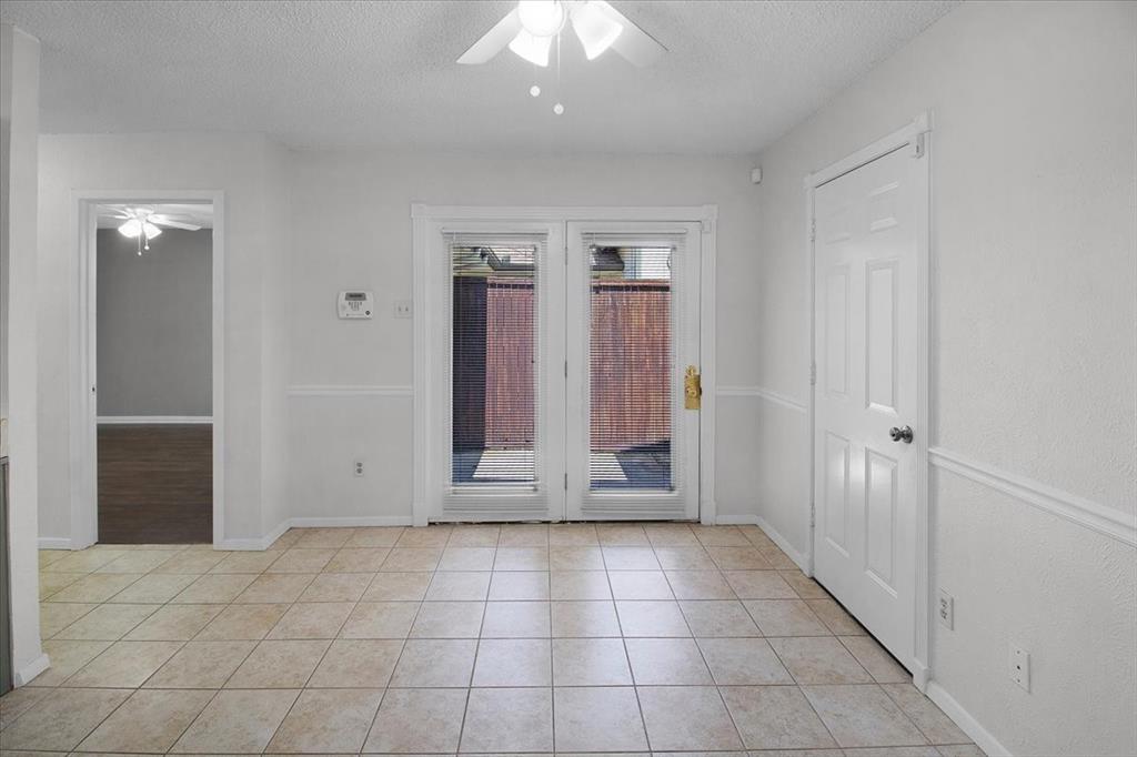 1903 Wyndemere Lane Garland, TX 75042 - Photo 16 of 28 an empty room with entrance and door
