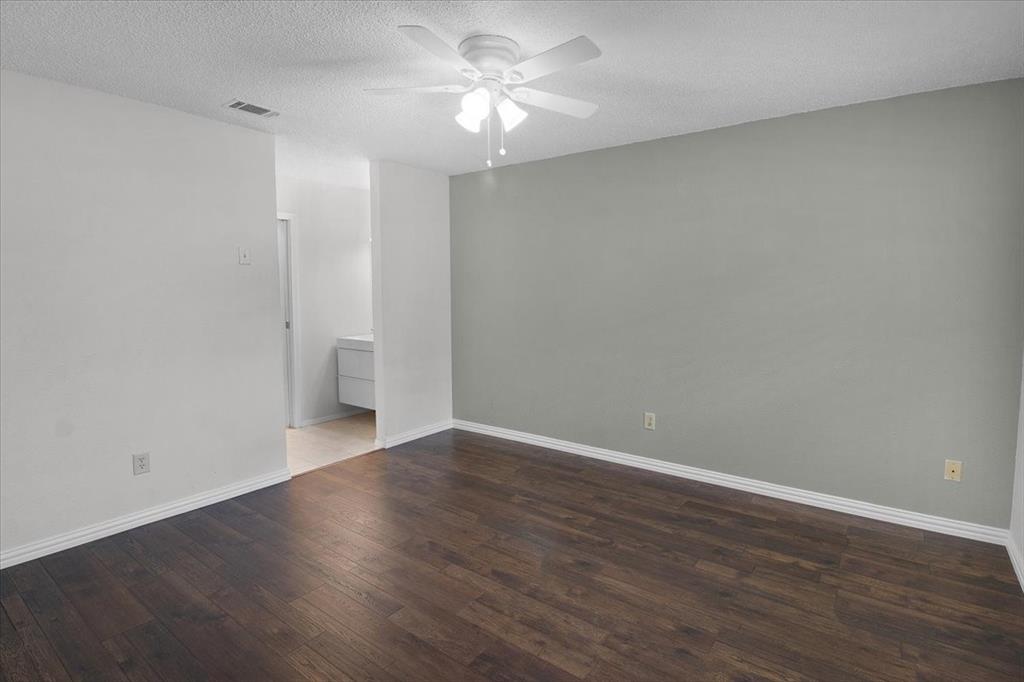 1903 Wyndemere Lane Garland, TX 75042 - Photo 21 of 28 a view of an empty room with wooden floor