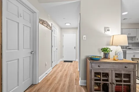 a view of an entryway of house and wooden floor