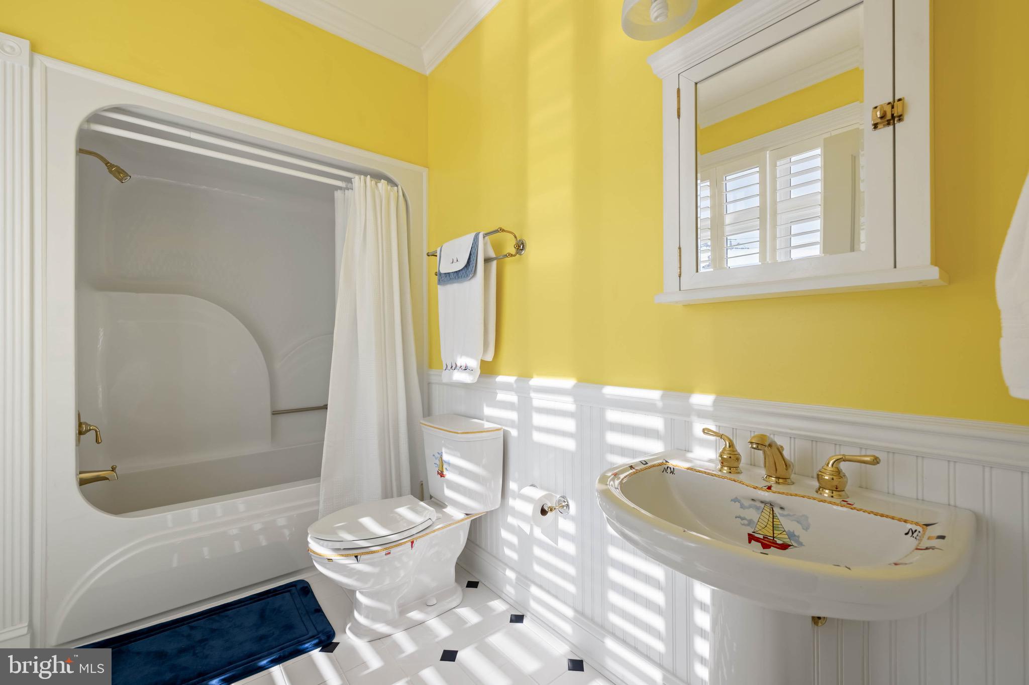 12959 Harbor Road Ocean City, MD 21842 - Photo 37 of 85 a bathroom with a sink and a mirror