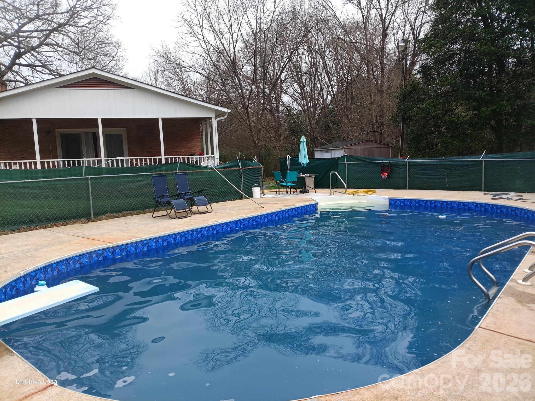128 Paul Snipes Road Lancaster, SC 29720 - Photo 29 of 29 a view of pool with umbrella and wooden fence