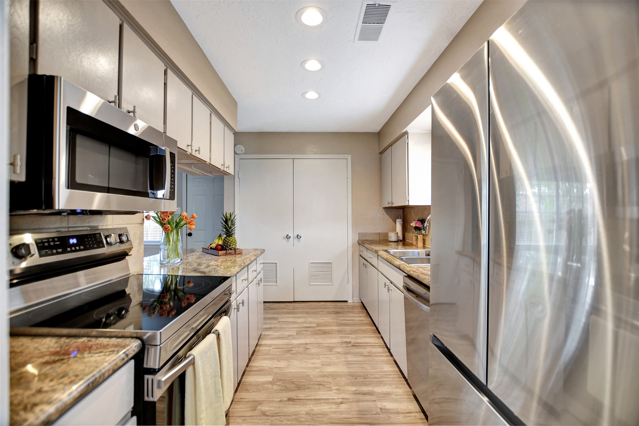 3826 Willow Springs Lane, Unit 3826 Houston, TX 77080 - Photo 29 of 43 a kitchen with stainless steel appliances a refrigerator sink and stove