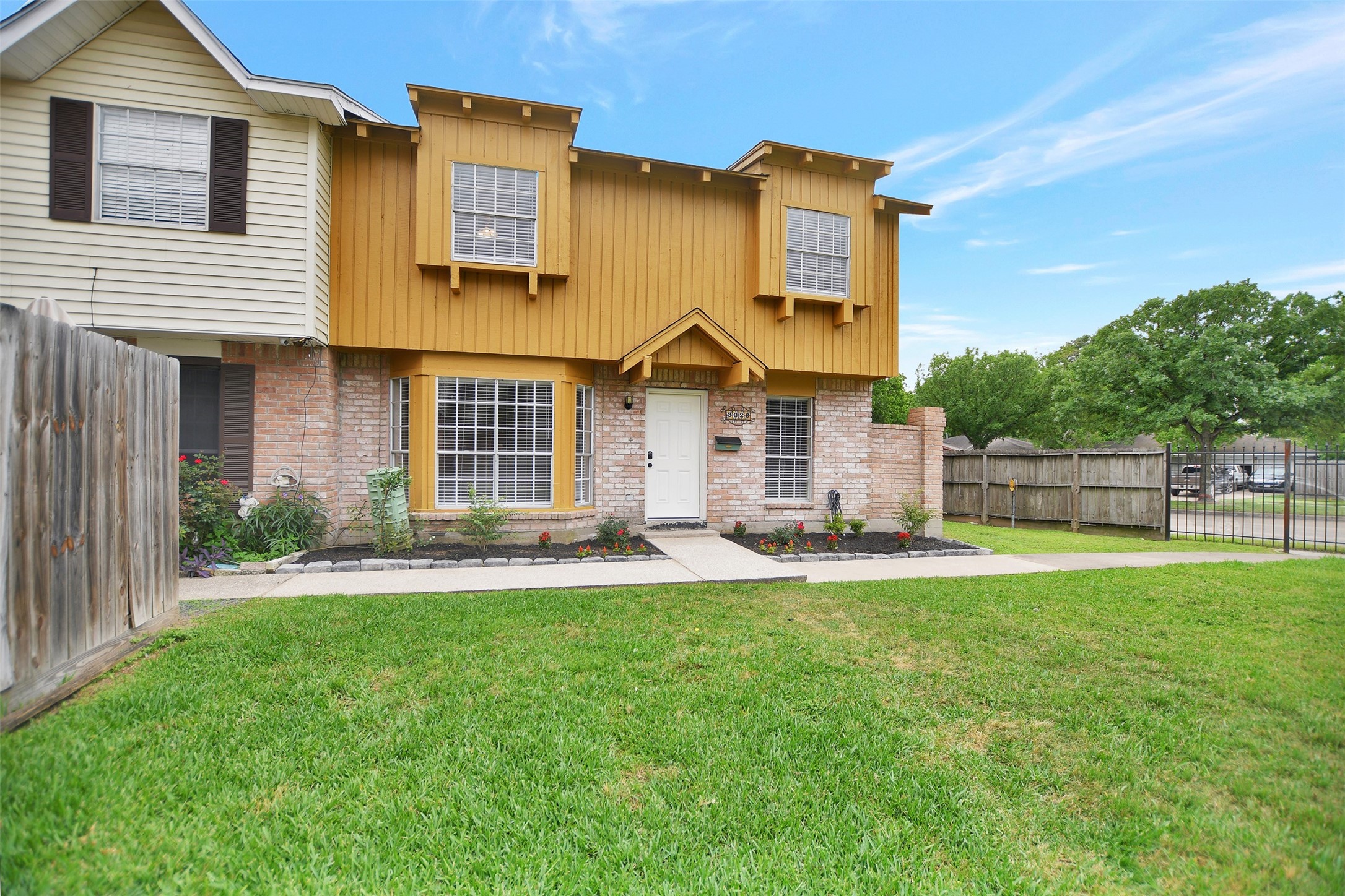 3826 Willow Springs Lane, Unit 3826 Houston, TX 77080 - Photo 3 of 43 a front view of a house with a yard and garage