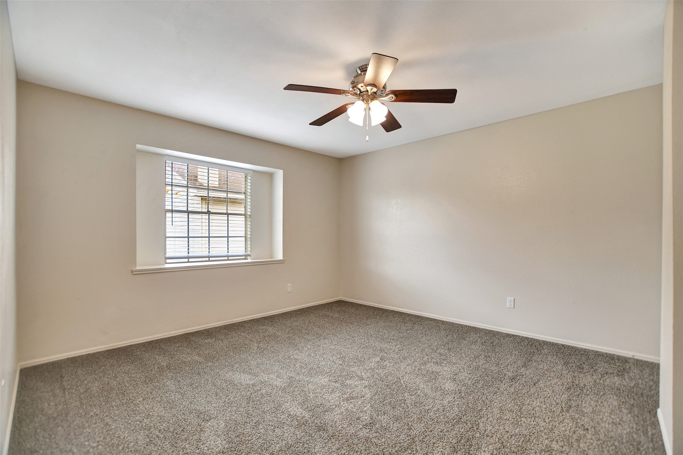 3826 Willow Springs Lane, Unit 3826 Houston, TX 77080 - Photo 37 of 43 an empty room with windows and fan