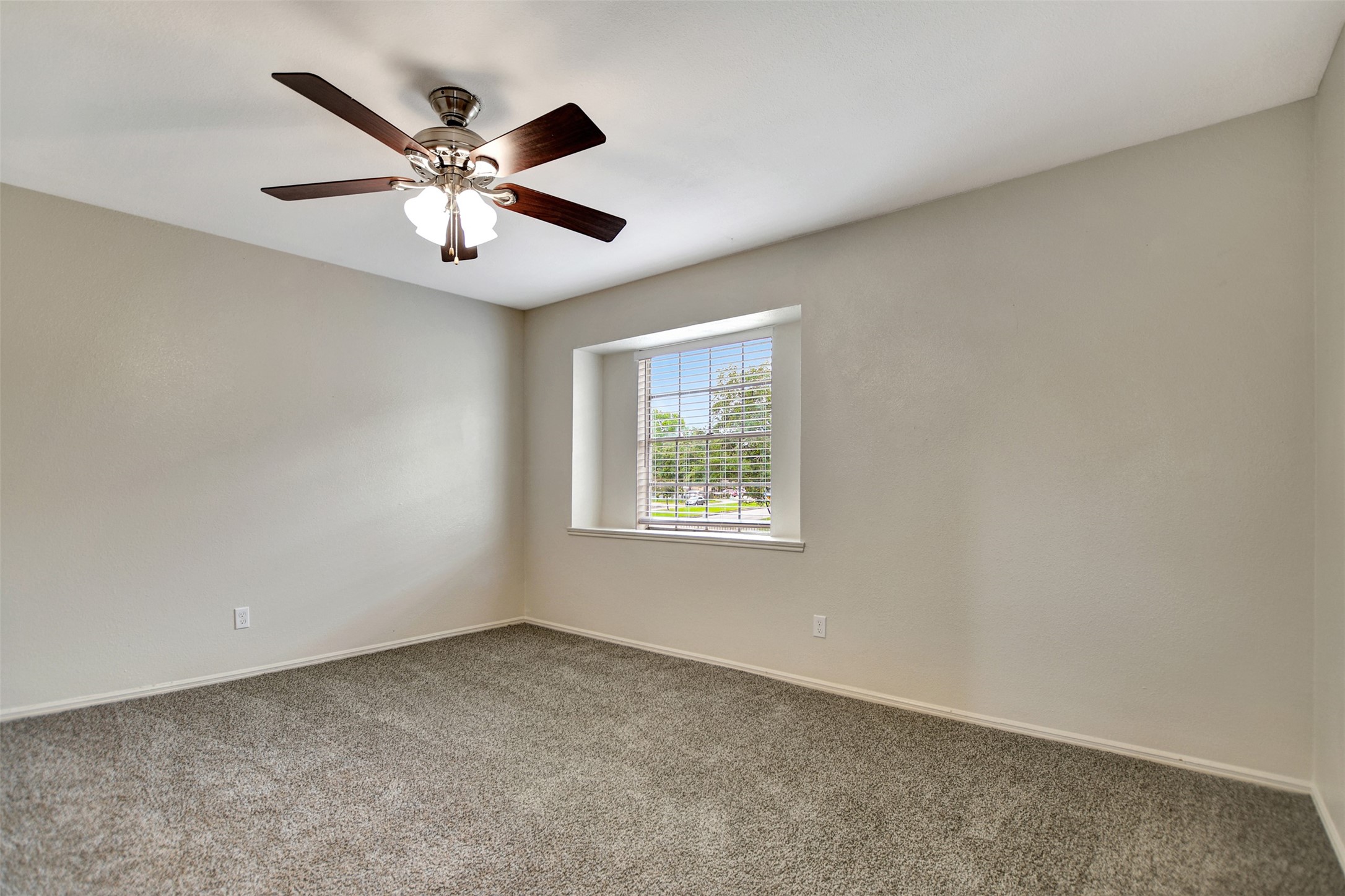 3826 Willow Springs Lane, Unit 3826 Houston, TX 77080 - Photo 38 of 43 an empty room with a window and a fan