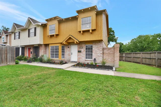 front view of a house with a yard