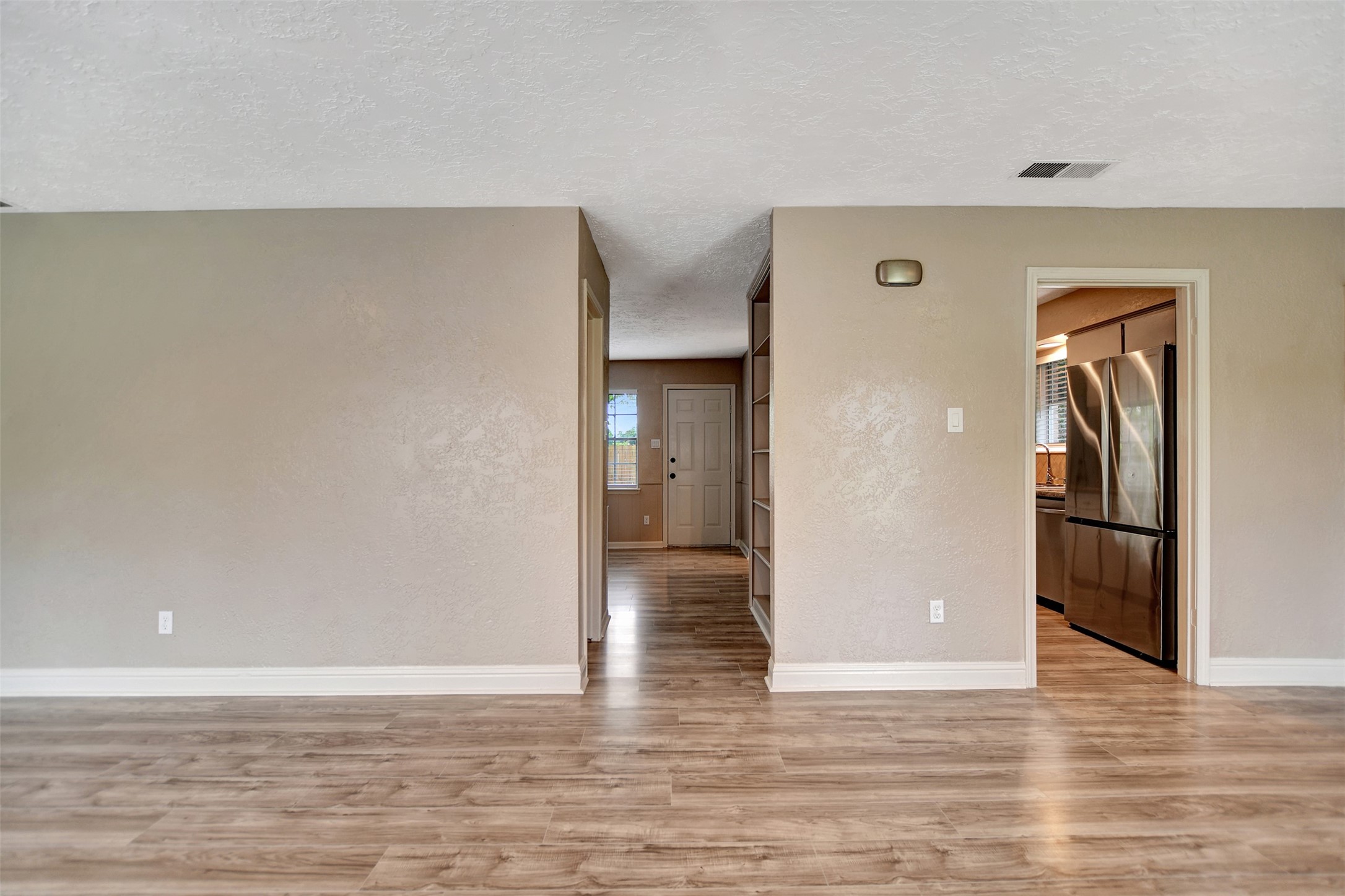 3826 Willow Springs Lane, Unit 3826 Houston, TX 77080 - Photo 6 of 43 a view of empty room with wooden floor