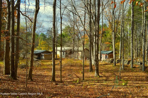 a view of pool of water with yard