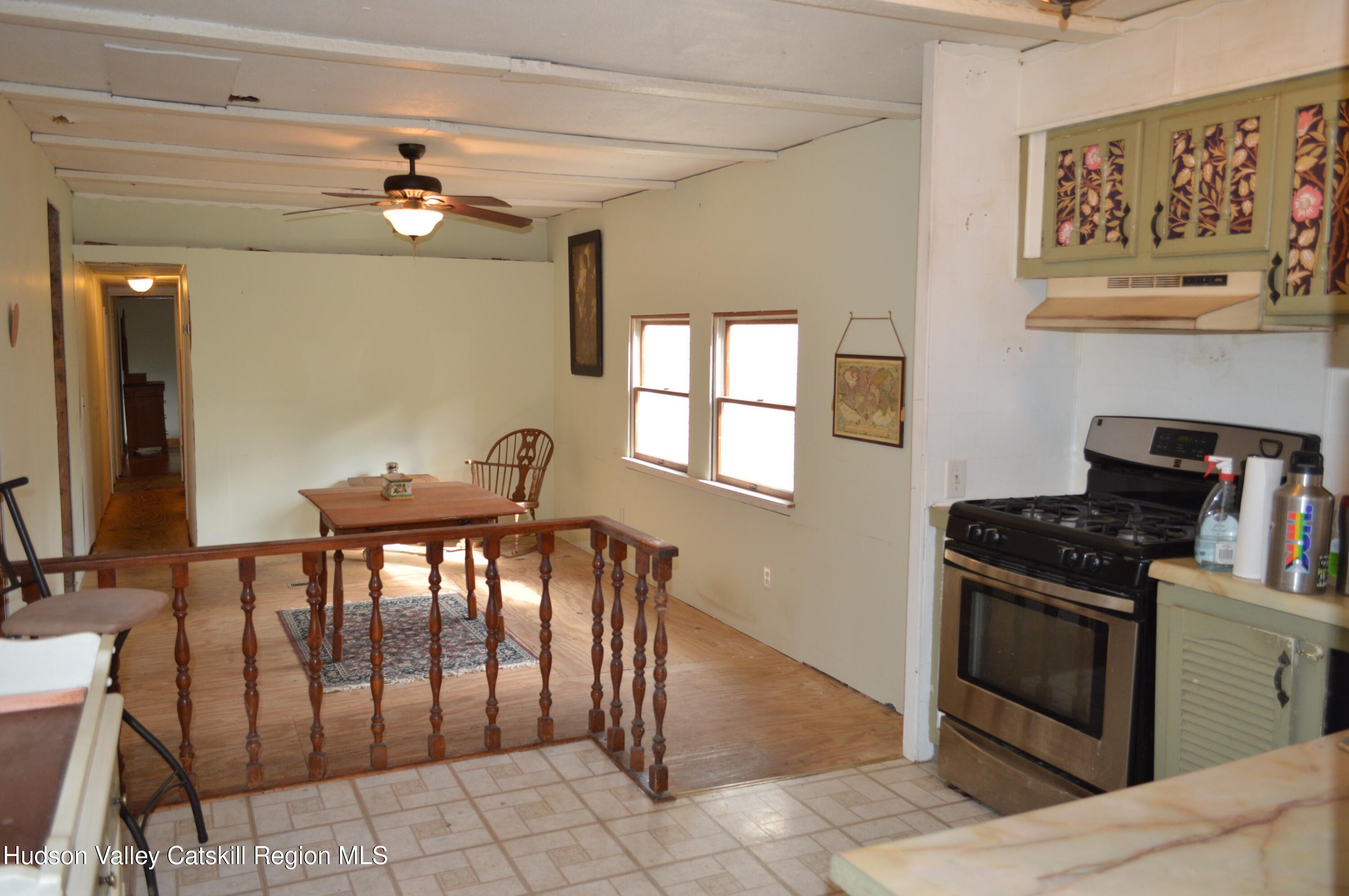 100 Meadow Lane Cairo, NY 12413 - Photo 11 of 18 a view of a dining room with furniture and a chandelier