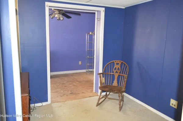 a view of a hallway with chairs