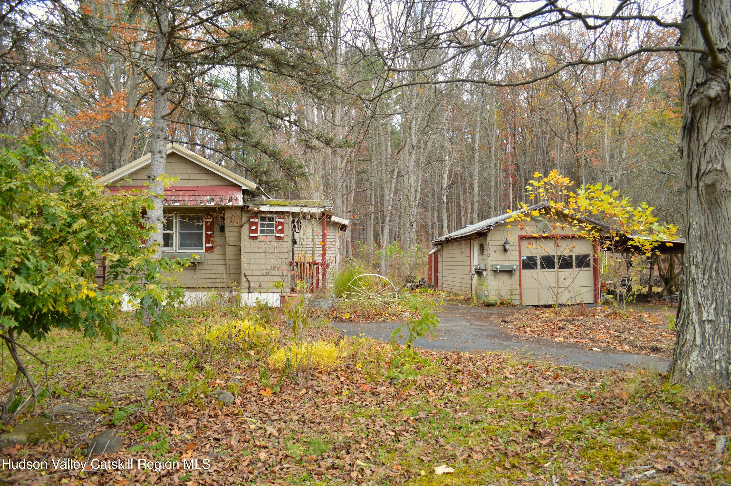 100 Meadow Lane Cairo, NY 12413 - Photo 3 of 18 a front view of a house with garden