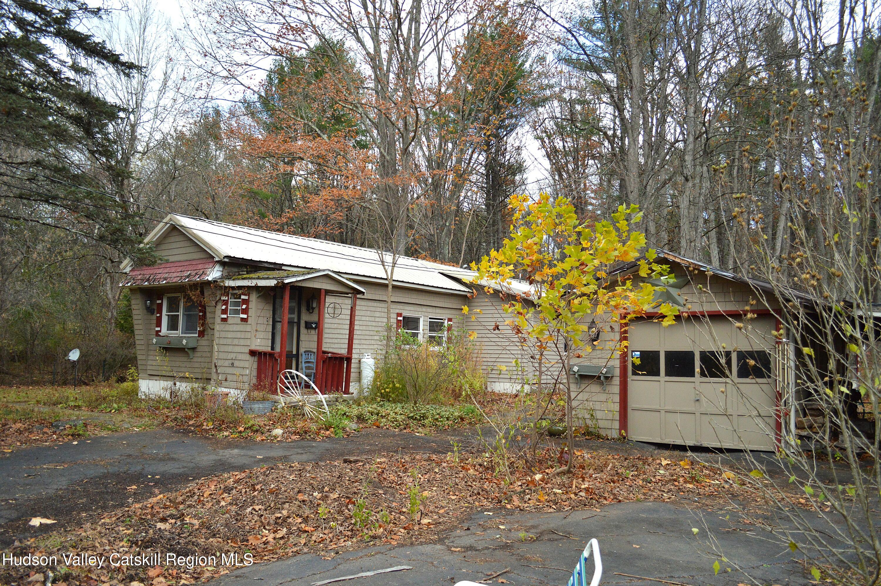 100 Meadow Lane Cairo, NY 12413 - Photo 4 of 18 a front view of a house with garden