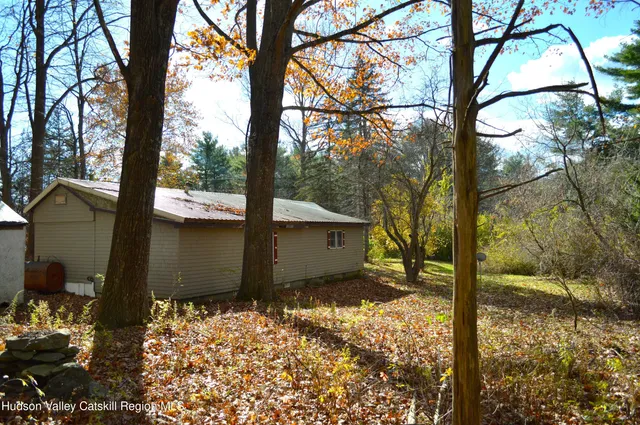 a view of a backyard of the house