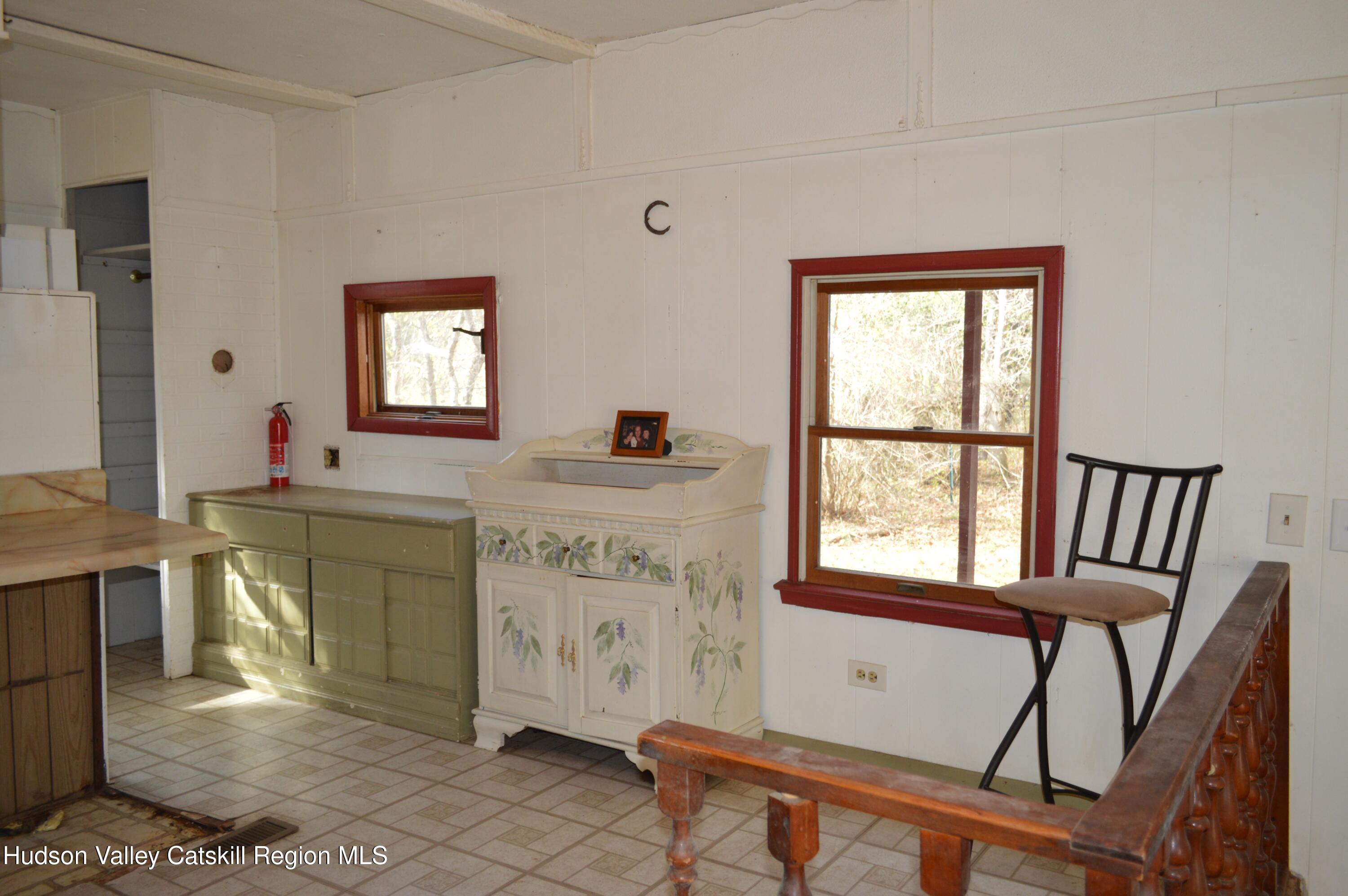 100 Meadow Lane Cairo, NY 12413 - Photo 10 of 18 a view of a kitchen area with furniture and windows