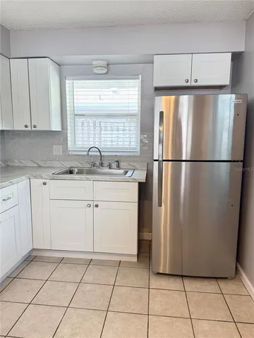 a kitchen with appliances cabinets and a sink