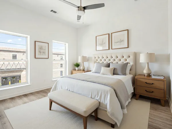 a bedroom with a bed and a night stand