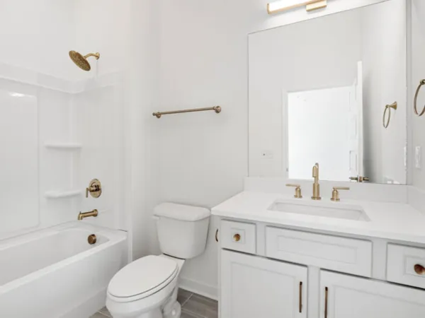 a bathroom with a sink a toilet and a bathtub