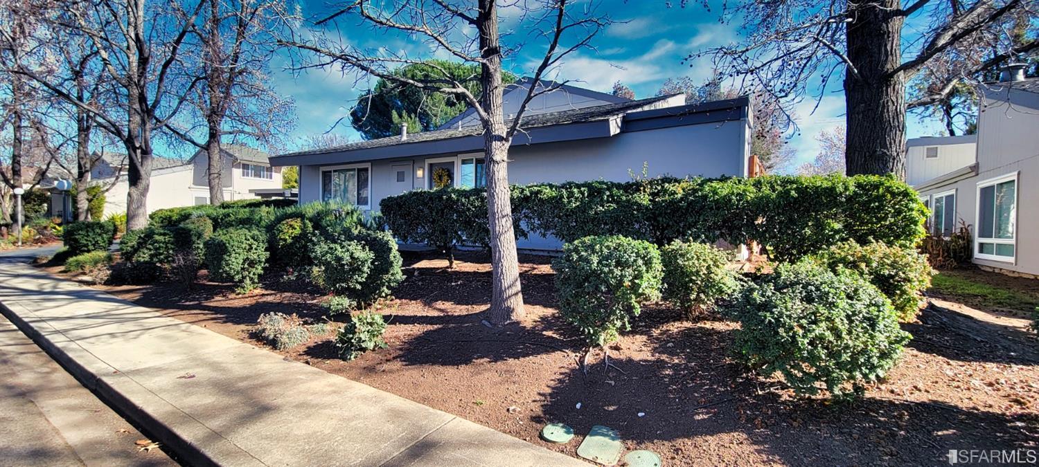 1200 Kenwal Road, Unit D Concord, CA 94521 - Photo 11 of 14 a view of a house with a yard and sitting area