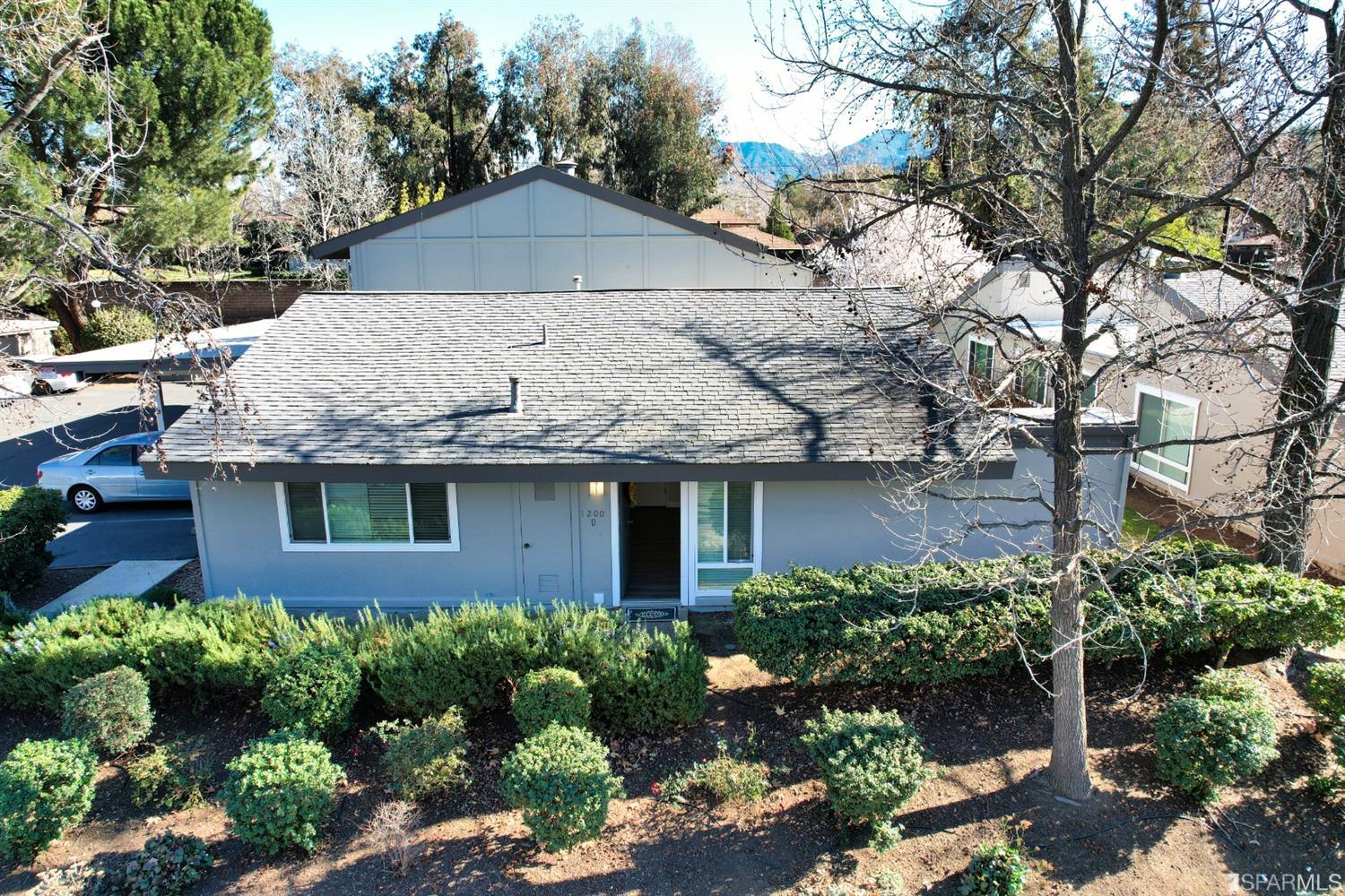1200 Kenwal Road, Unit D Concord, CA 94521 - Photo 12 of 14 a front view of a house with a yard and garage