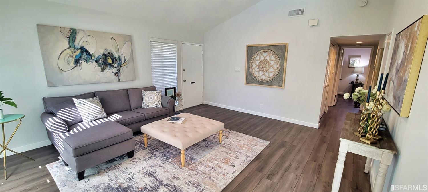 1200 Kenwal Road, Unit D Concord, CA 94521 - Photo 4 of 14 a living room with furniture and wooden floor
