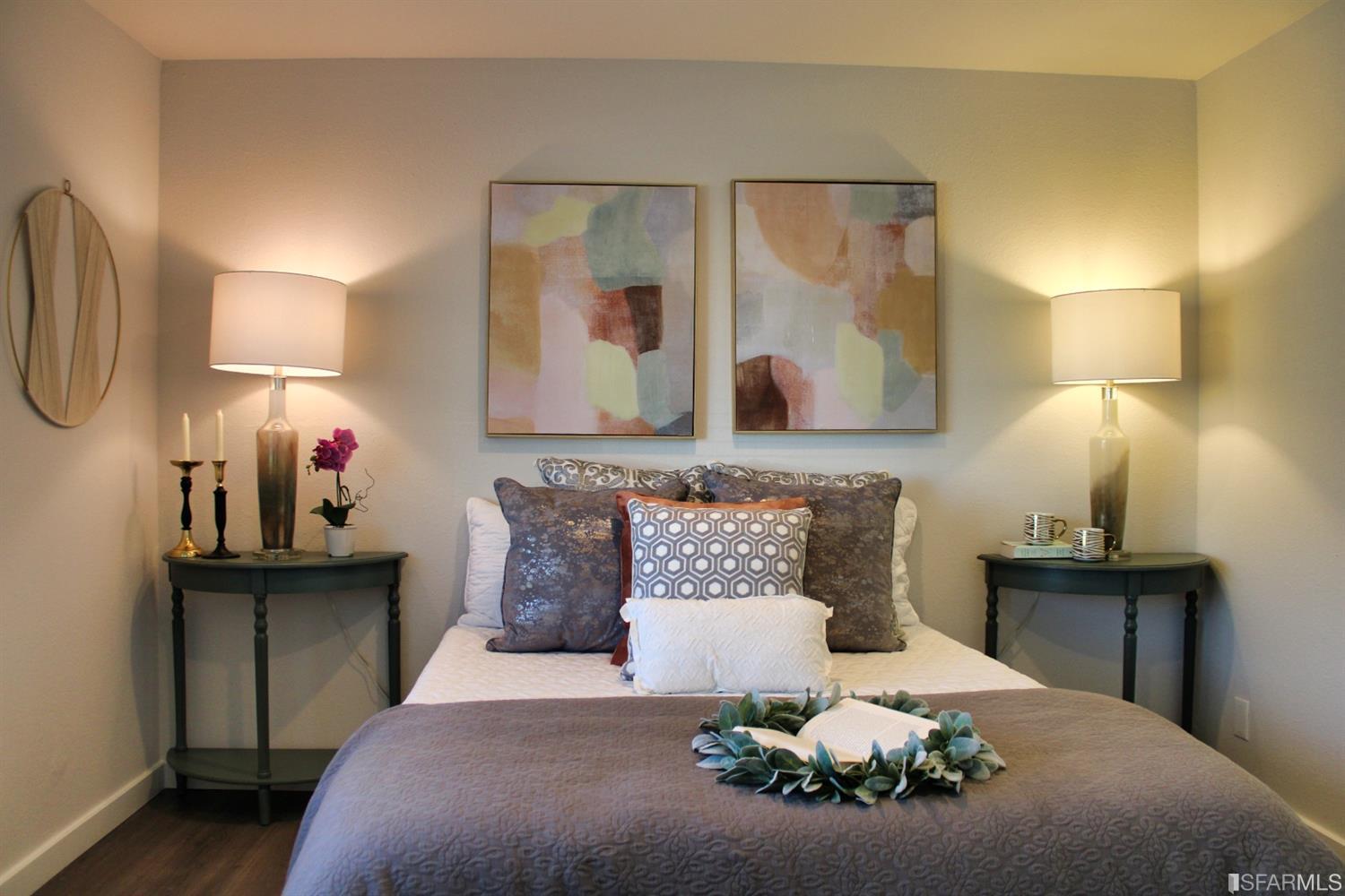 1200 Kenwal Road, Unit D Concord, CA 94521 - Photo 8 of 14 a bed room with a bed mirror and wall painting