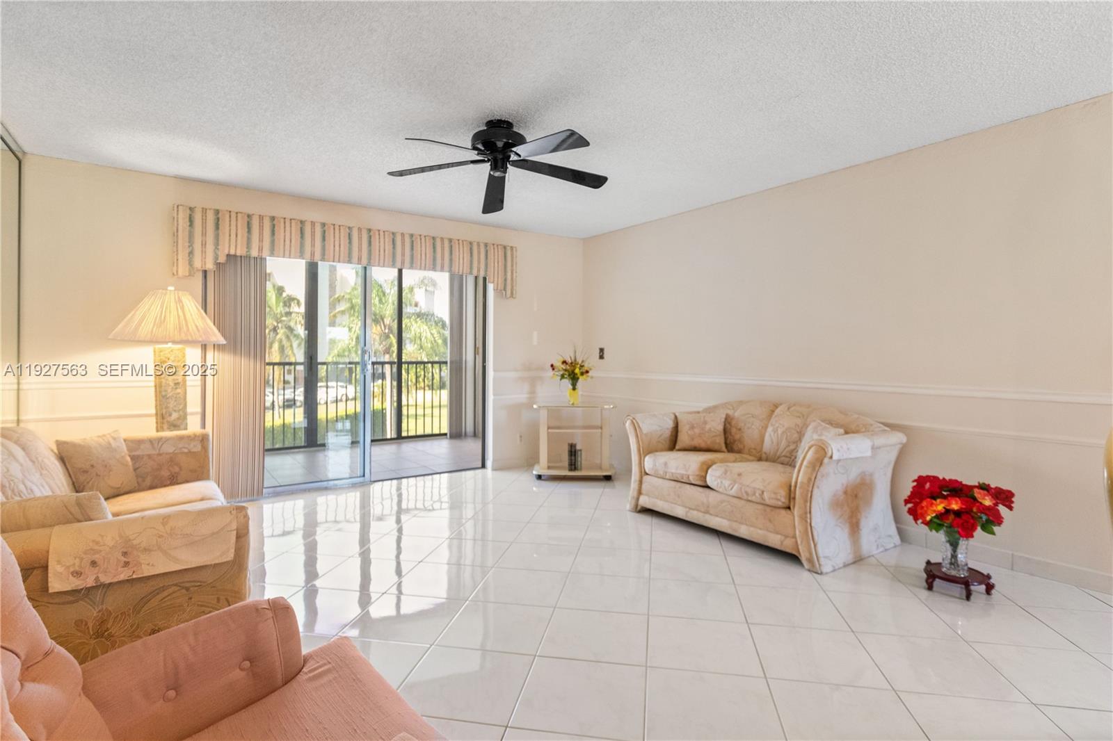 190 Southeast 5th Avenue, Unit 202 Dania Beach, FL 33004 - Photo 11 of 36 a living room with furniture and a large window
