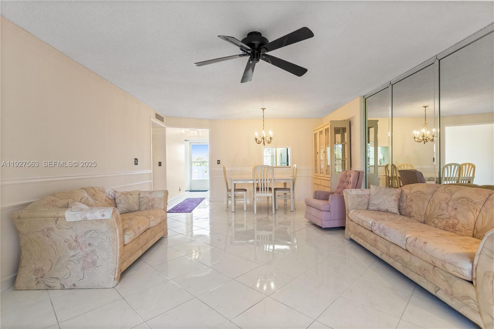 190 Southeast 5th Avenue, Unit 202 Dania Beach, FL 33004 - Photo 13 of 36 a living room with furniture and a large window