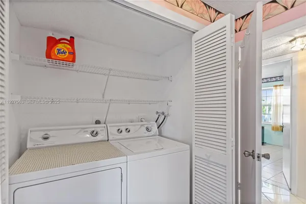 a utility room with dryer and washer