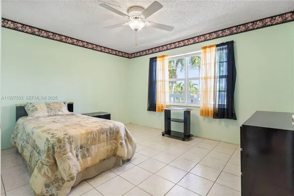 a bedroom with a bed and a table in it