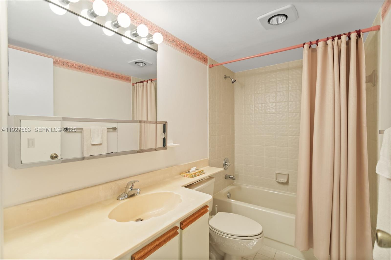 190 Southeast 5th Avenue, Unit 202 Dania Beach, FL 33004 - Photo 23 of 36 a bathroom with a sink a toilet and shower