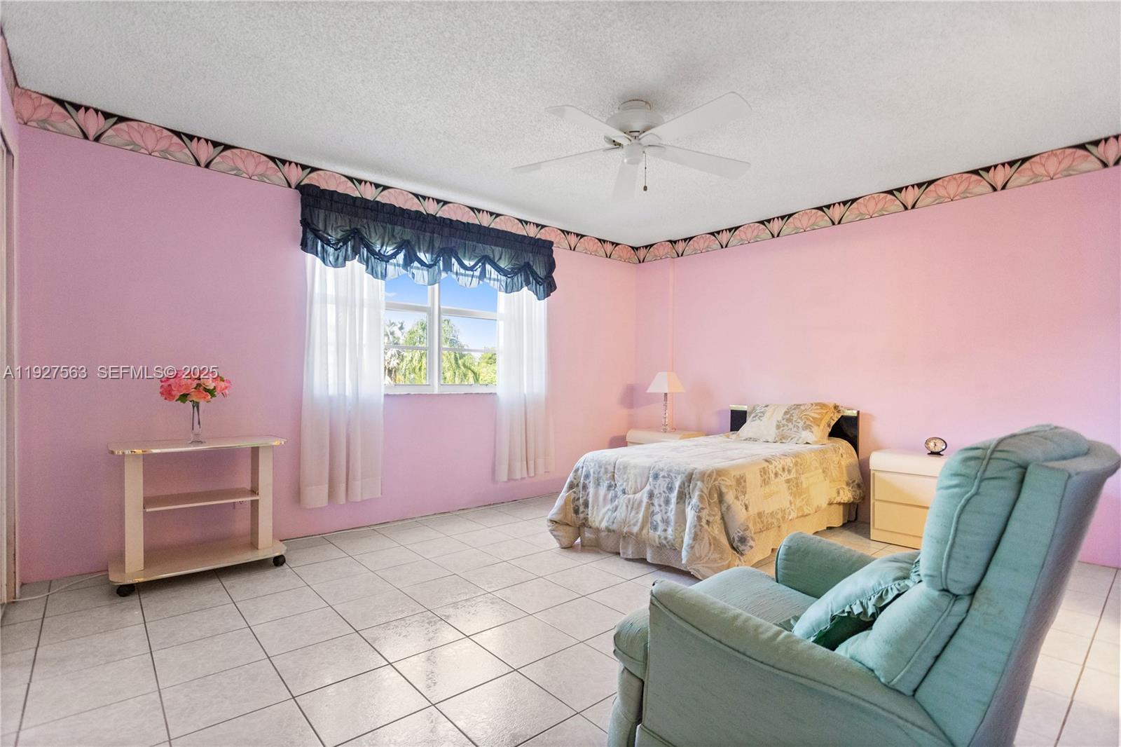 190 Southeast 5th Avenue, Unit 202 Dania Beach, FL 33004 - Photo 26 of 36 a bed room with a bed and a window