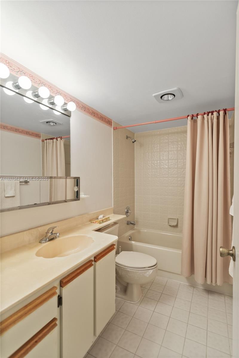 190 Southeast 5th Avenue, Unit 202 Dania Beach, FL 33004 - Photo 30 of 36 a bathroom with a sink a toilet and bathtub