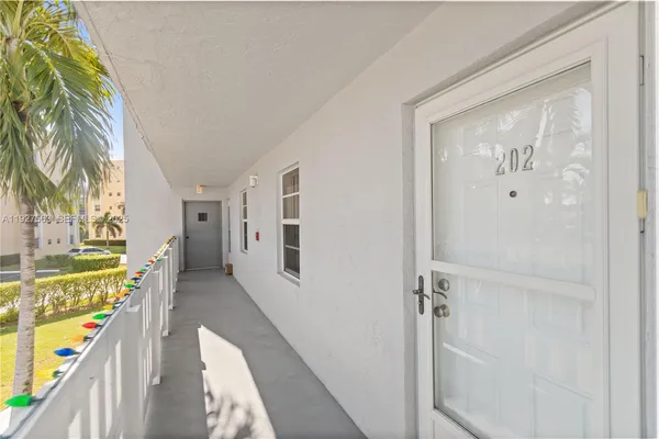 a view of a hallway with paintings on the wall
