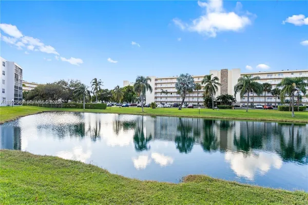 a view of a lake with houses in the background