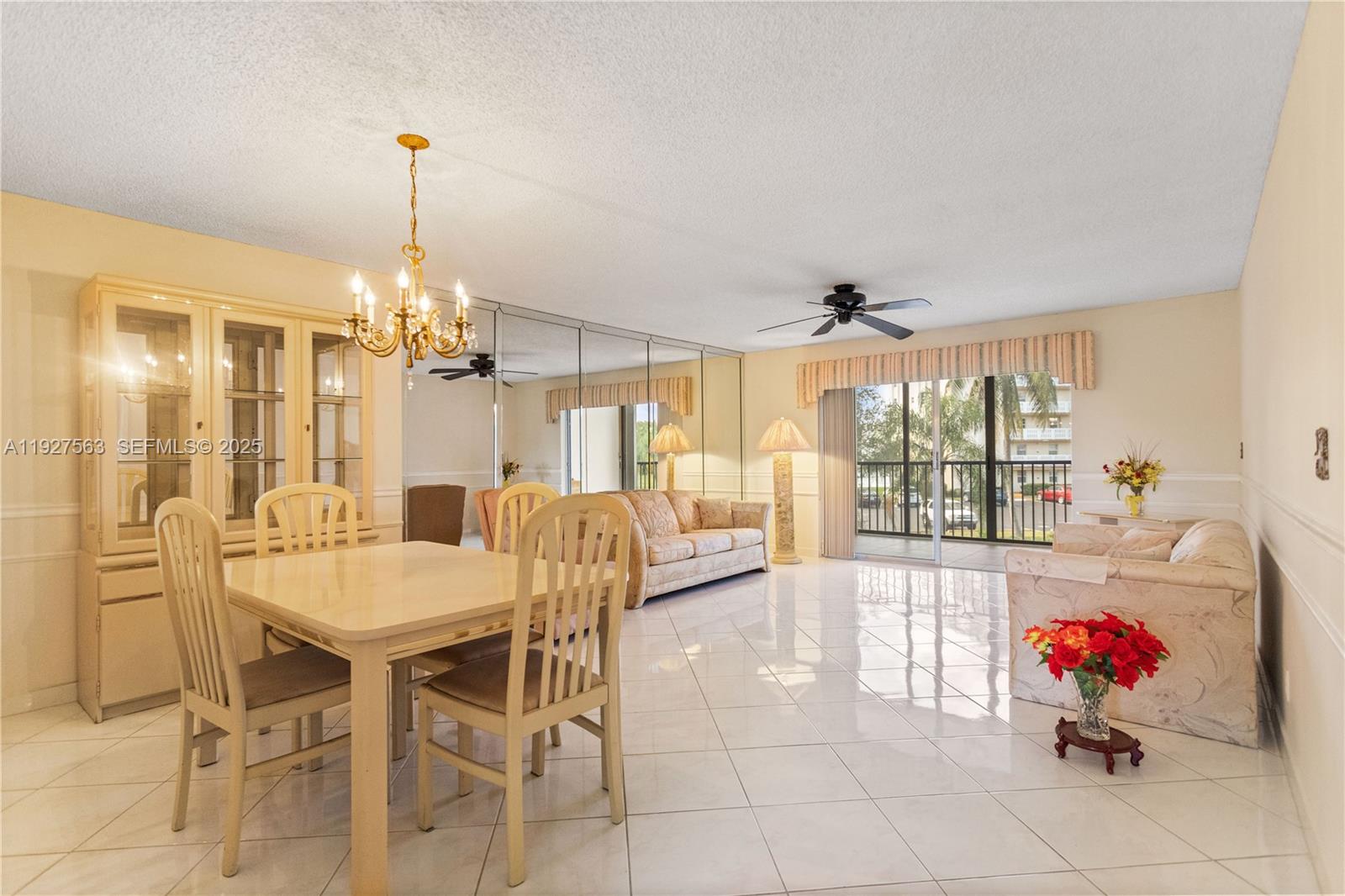 190 Southeast 5th Avenue, Unit 202 Dania Beach, FL 33004 - Photo 7 of 36 a view of a dining room and livingroom with furniture wooden floor a chandelier