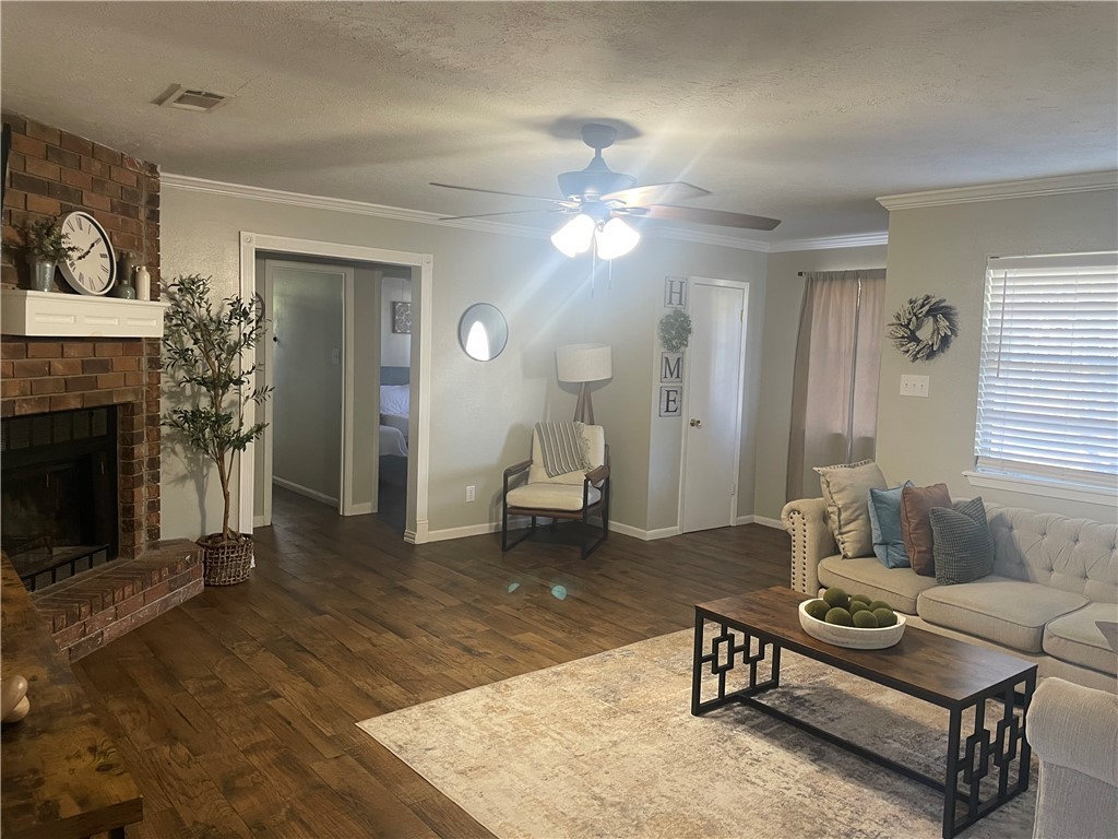 4310 Meadowbrook Drive Bryan, TX 77802 - Photo 3 of 10 a living room with furniture and a fireplace