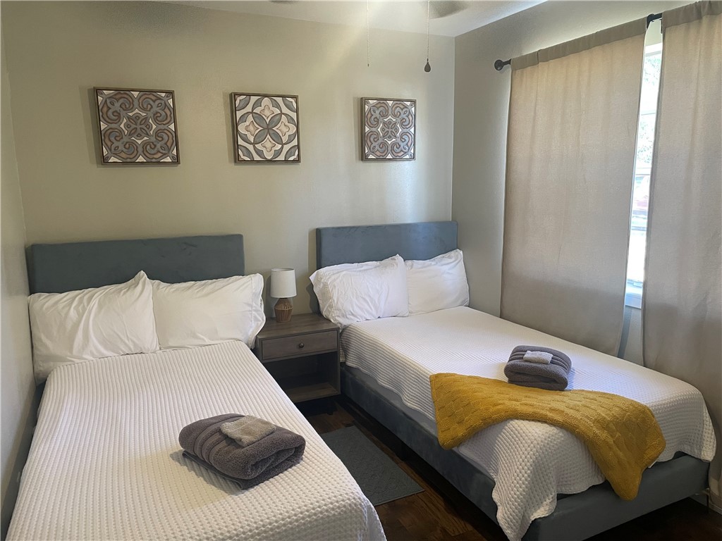 4310 Meadowbrook Drive Bryan, TX 77802 - Photo 4 of 10 a bedroom with a bed and a lamp