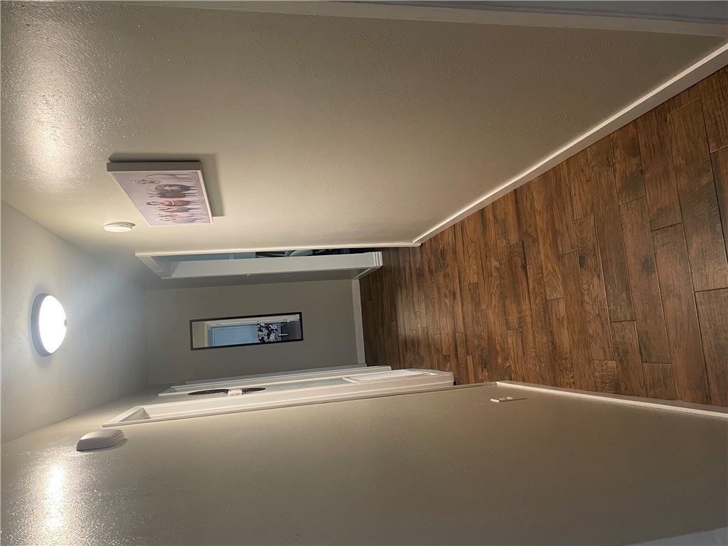 4310 Meadowbrook Drive Bryan, TX 77802 - Photo 6 of 10 a view of a hallway with wooden floor