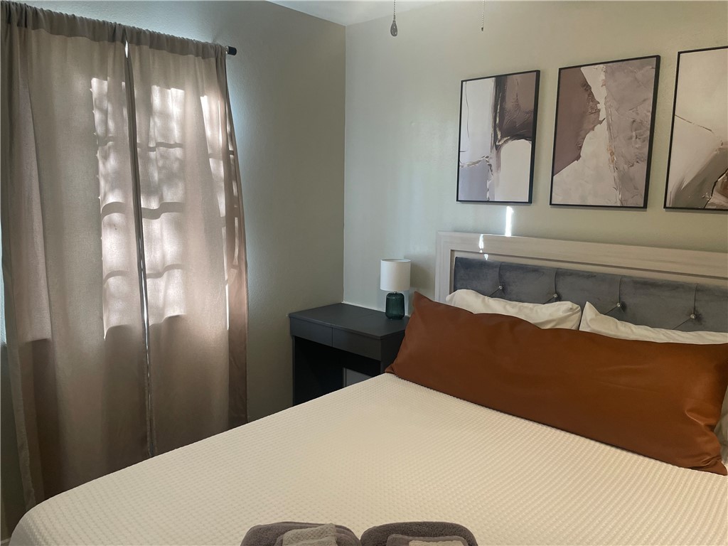 4310 Meadowbrook Drive Bryan, TX 77802 - Photo 7 of 10 a bedroom with a bed and a window