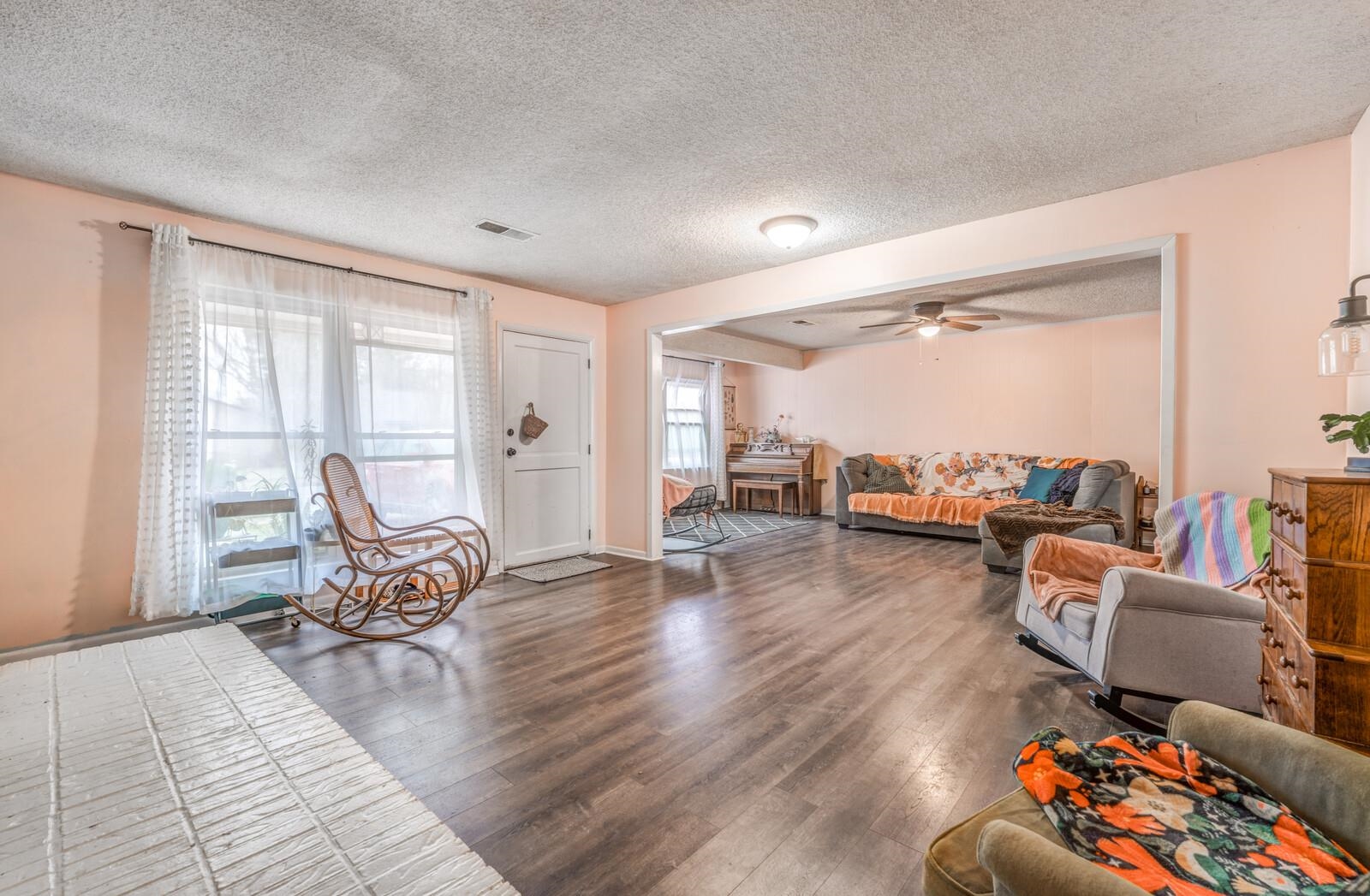 4660 Vincent Road Millington, TN 38053 - Photo 10 of 37 Living room with a ceiling fan, a textured ceiling, visible vents, and wood finished floors